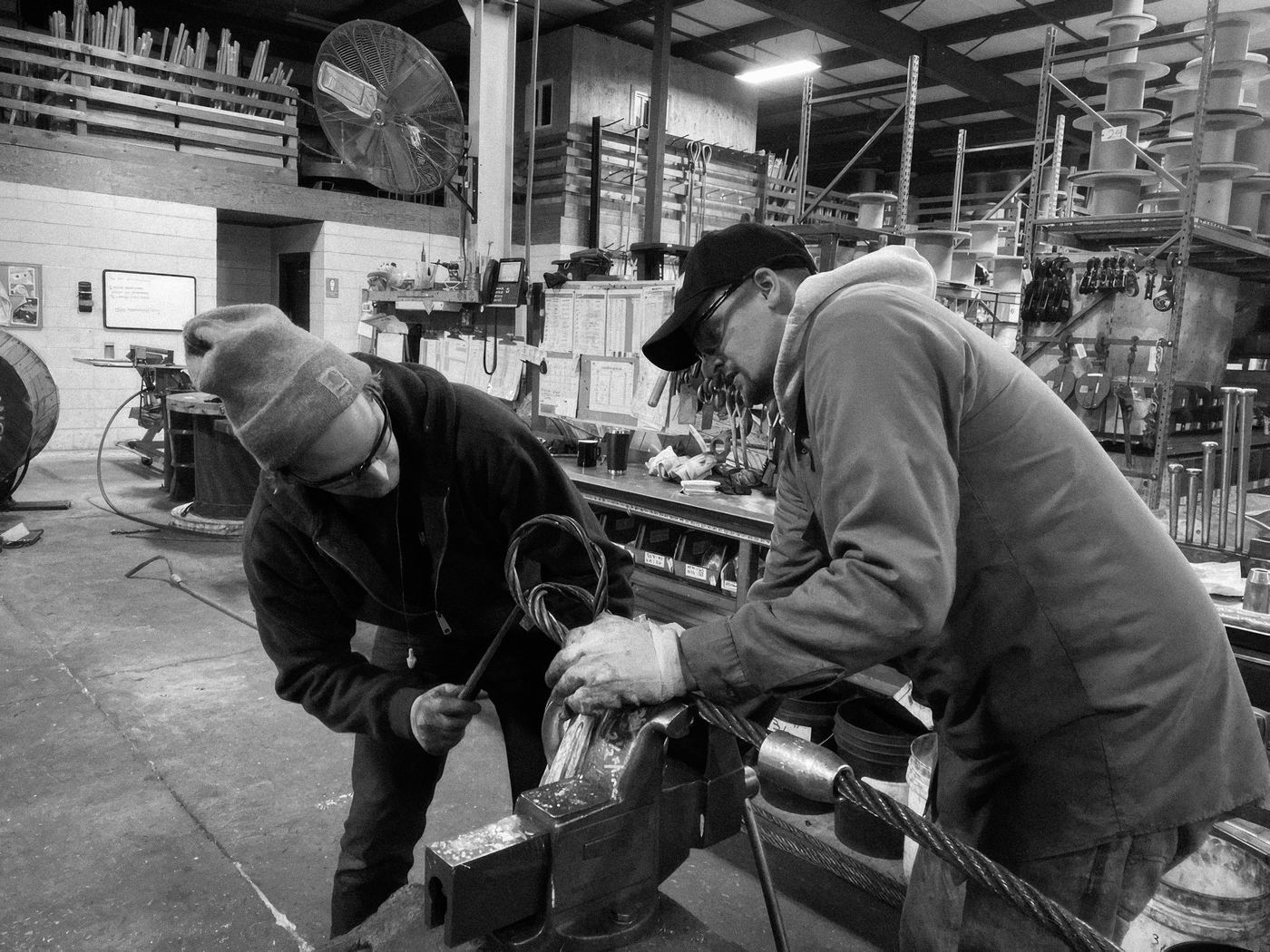 Steve and Rob Nelson splicing a wire rope sling on the bench in the Hatfield shop