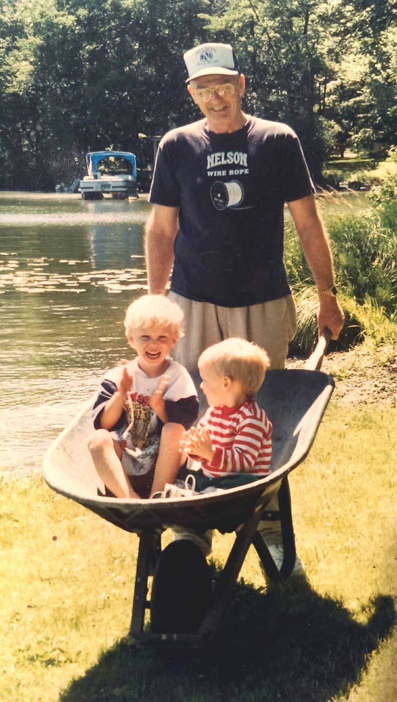 Jack Nelson with Steve and Rob in a wheelbarrow